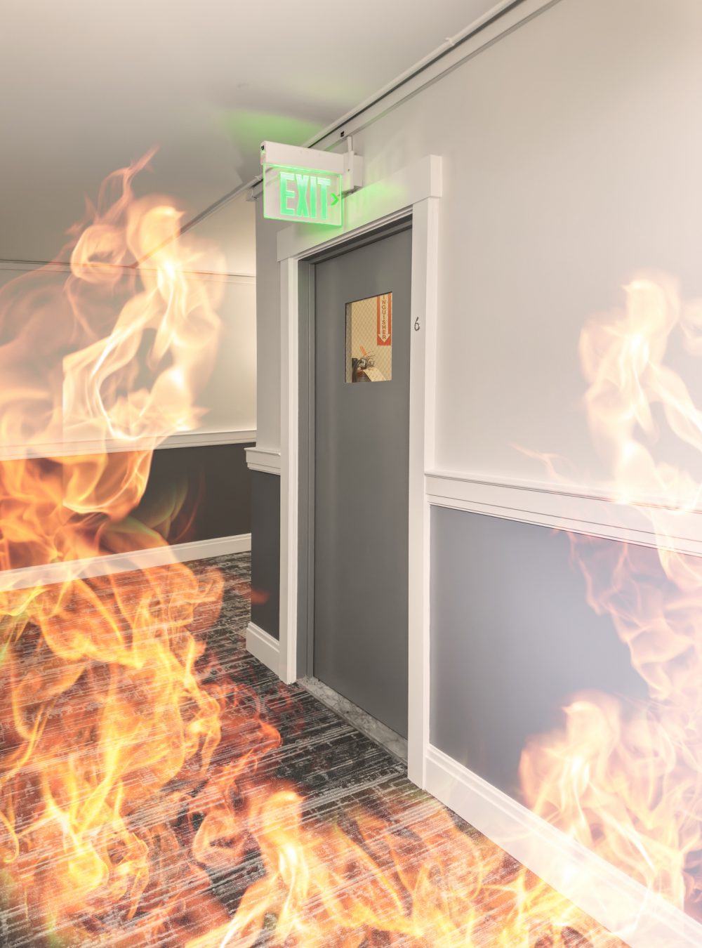 Emergency exit door during fire with flames